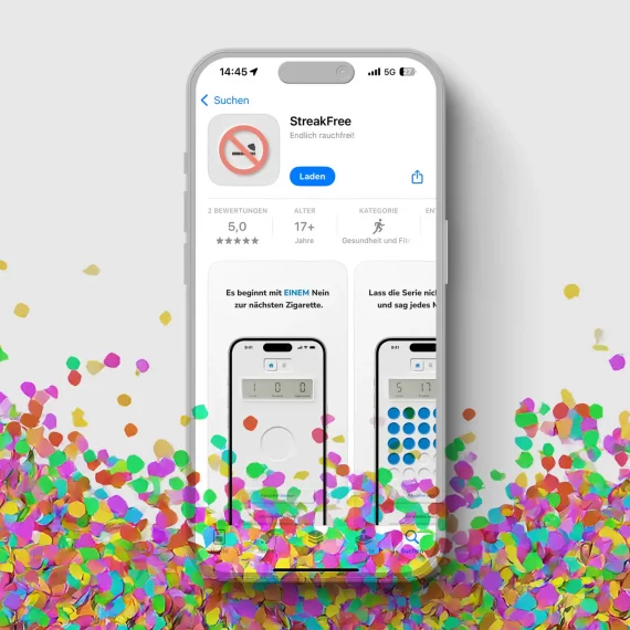 Mit Vibe-Coding in den AppStore? Ja, die "StreakFree"-App ist im Apple App Store erhältlich! Dieses Bild feiert den Launch mit Konfetti und zeigt drei iPhone-Mockups, die die Funktionen der App illustrieren: Fortschritts-Tracking, ein Reflektions-Tool und eine Verlaufsübersicht.
